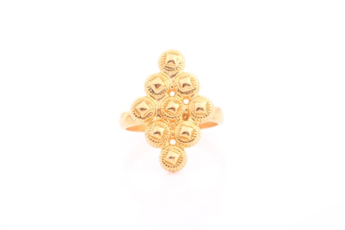 Lot 214 - An Indian yellow metal diamond-shaped ring,...