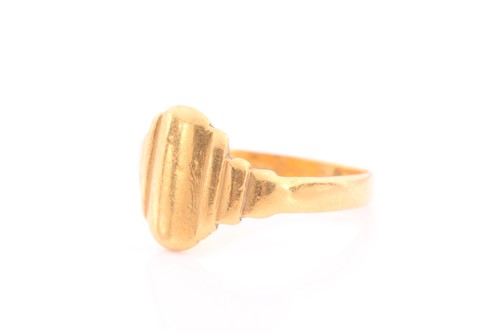Lot 64 - A yellow metal signet ring, possibly Indian,...