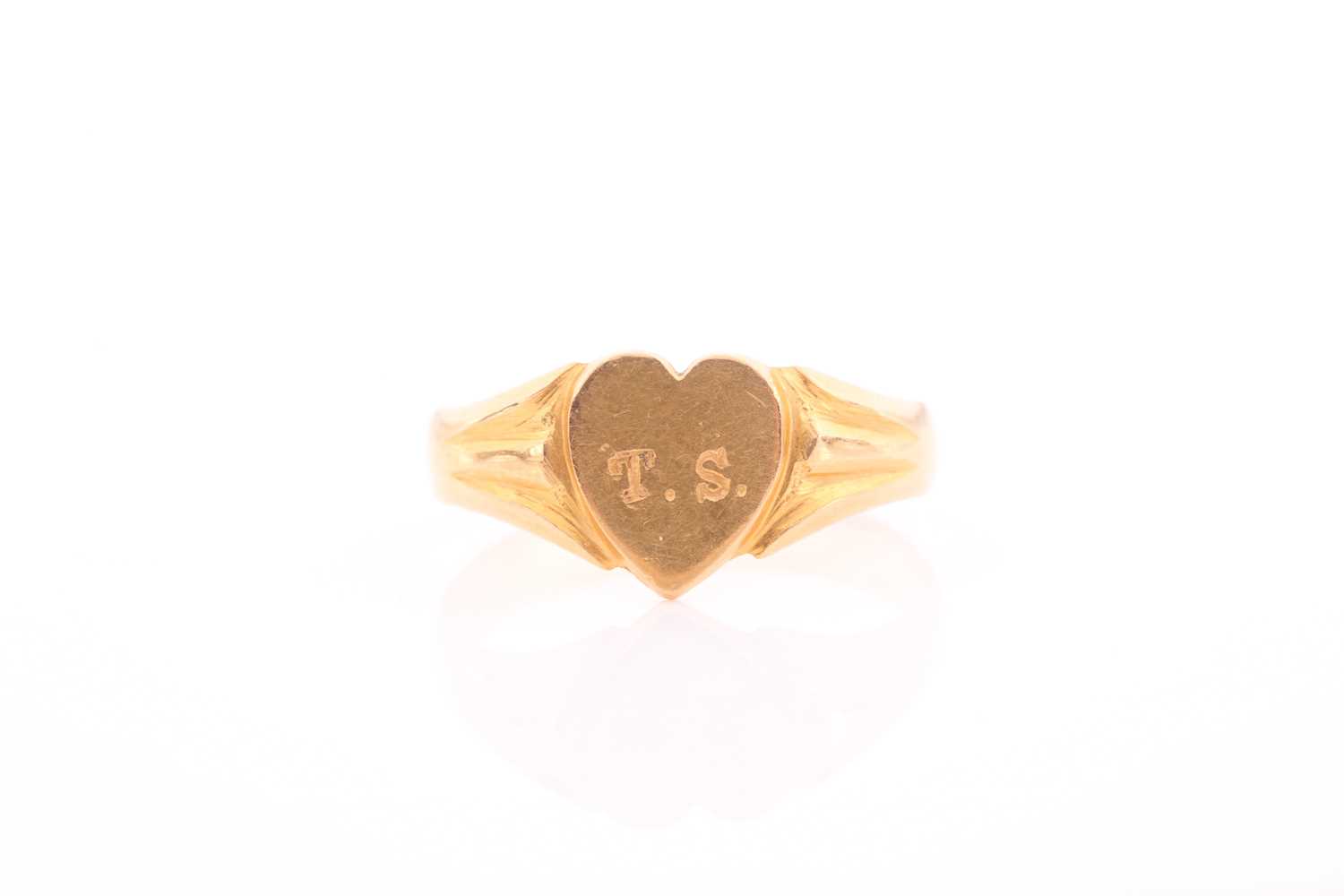 Lot 271 - A yellow metal signet ring, the heart-shaped...