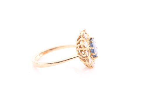 Lot 368 - A sapphire and diamond cluster ring; the oval...