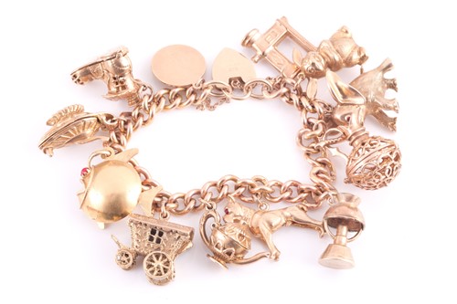 Lot 41 - A 9 carat gold charm bracelet, the curb...