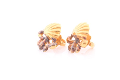 Lot 219 - A pair of yellow metal earrings, of shell...