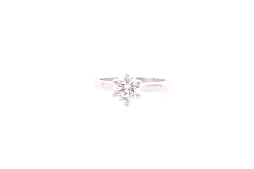 Lot 300 - A single stone diamond ring; the round...