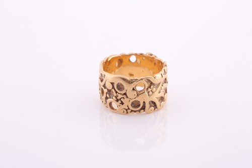 Lot 336 - A plain gold eternity band, with raised...
