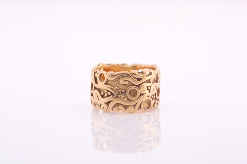 Lot 336 - A plain gold eternity band, with raised...
