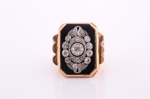 Lot 550 - A yellow metal and diamond ring, the chamfered...