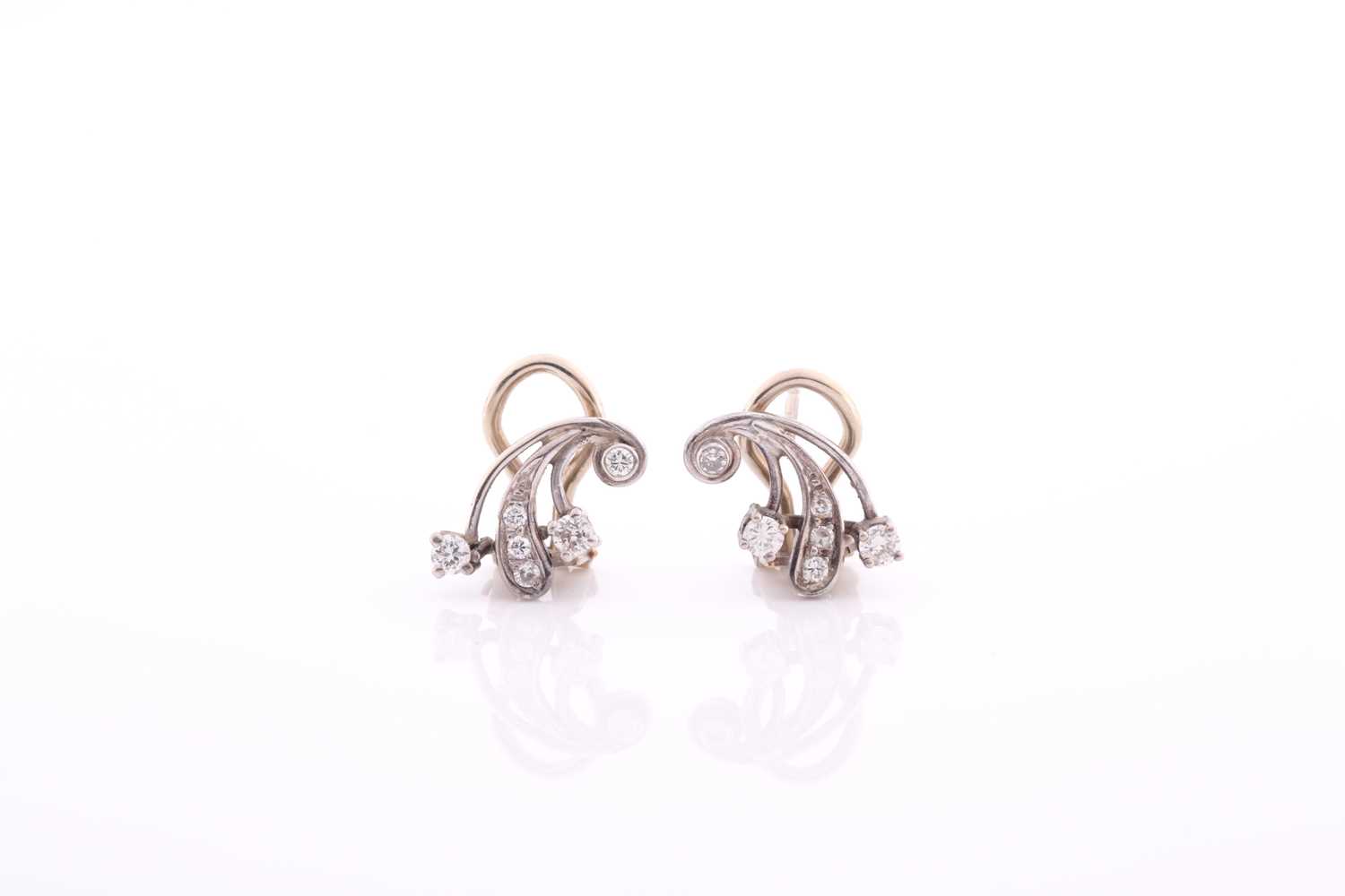 Lot 73 - A pair of white metal and diamond earrings, of...
