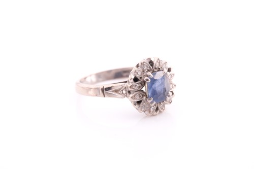 Lot 155 - A pale sapphire and diamond cluster ring, the...