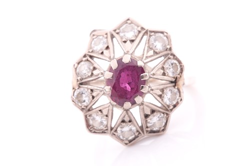 Lot 360 - An Art Deco ruby and diamond cluster ring; the...