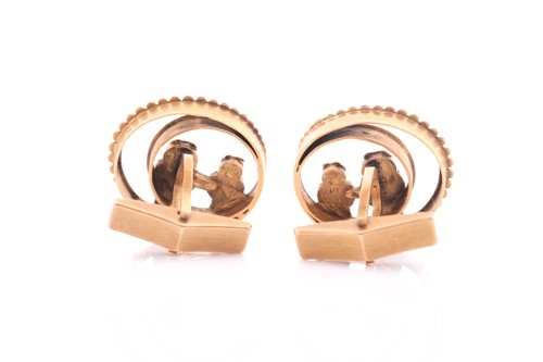Lot 29 - A pair of American owl cufflinks; depicted as...