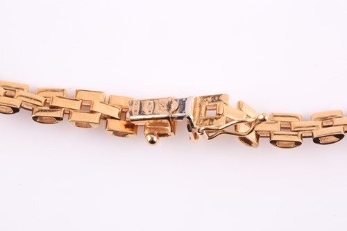 Lot 135 - An 18ct yellow gold brick-link articulated...