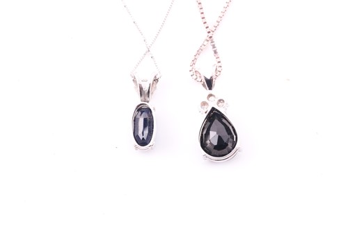 Lot 90 - A white metal and sapphire pendant set with a...