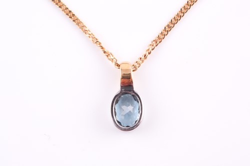 Lot 145 - A single stone blue topaz pendant; the oval...