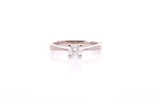 Lot 230 - A single stone diamond ring; the round...