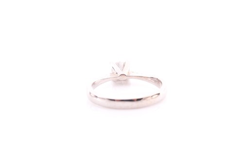 Lot 230 - A single stone diamond ring; the round...