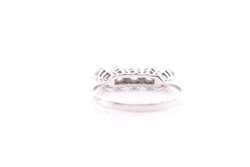 Lot 72 - A five stone half hoop diamond ring; the...