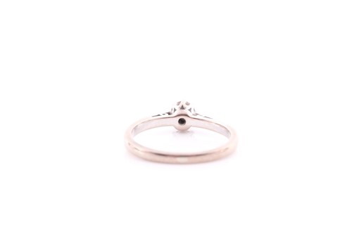 Lot 143 - A single stone diamond ring, the round...