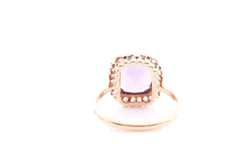 Lot 168 - An amethyst and diamond cluster ring; the...
