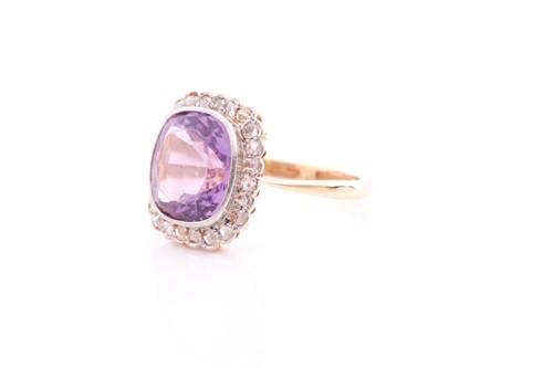 Lot 168 - An amethyst and diamond cluster ring; the...