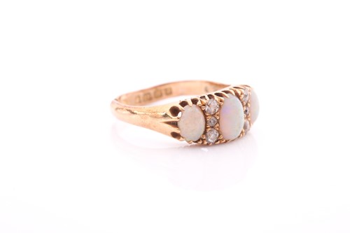 Lot 8 - An Edwardian opal and diamond ring; the three...