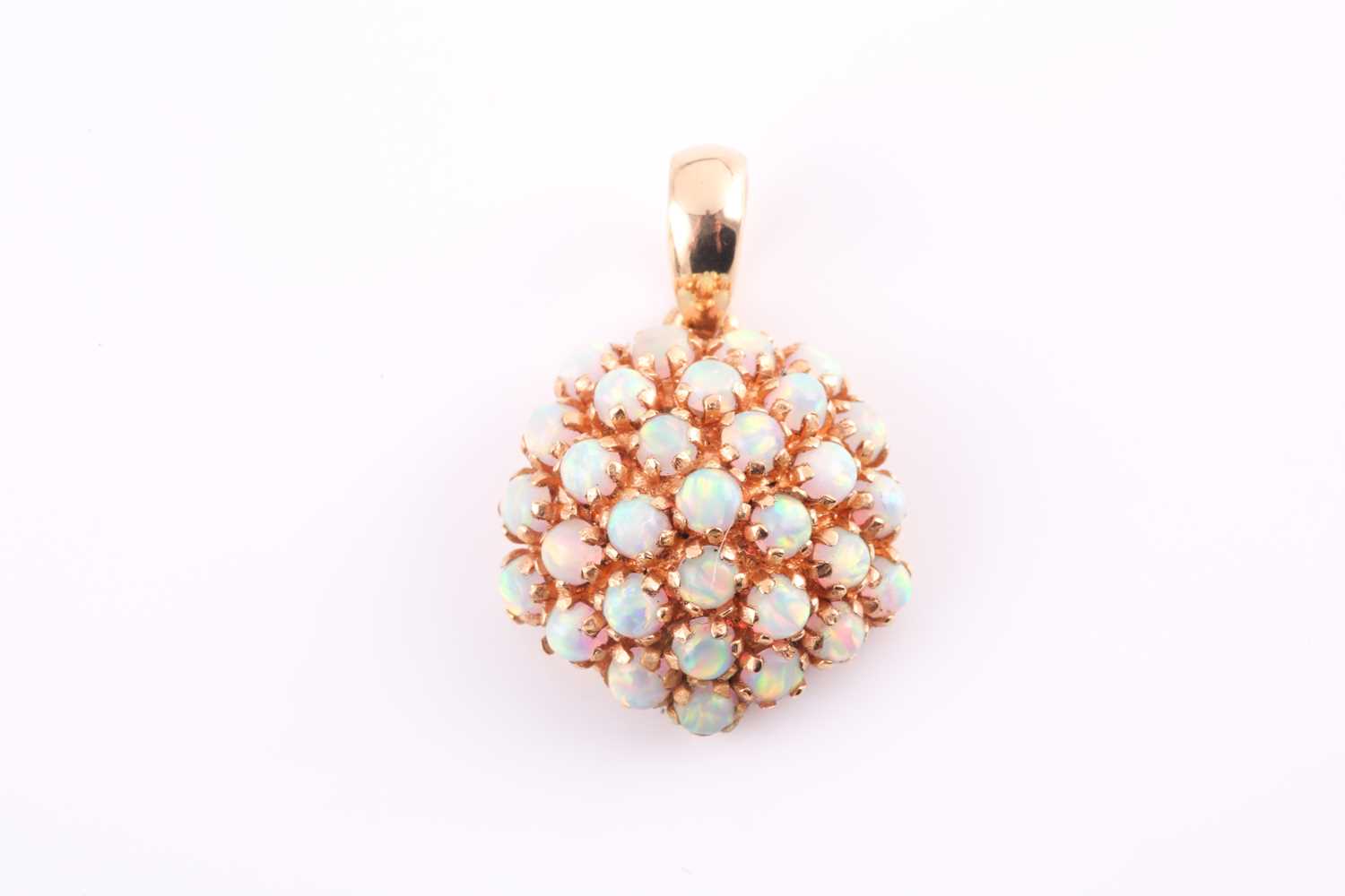 Lot 9 - An opal cluster pendant, the circular bombé...