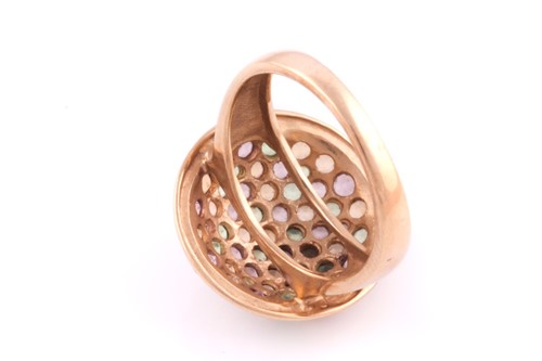 Lot 4 - A multi gem-set dress ring; the domed cluster...