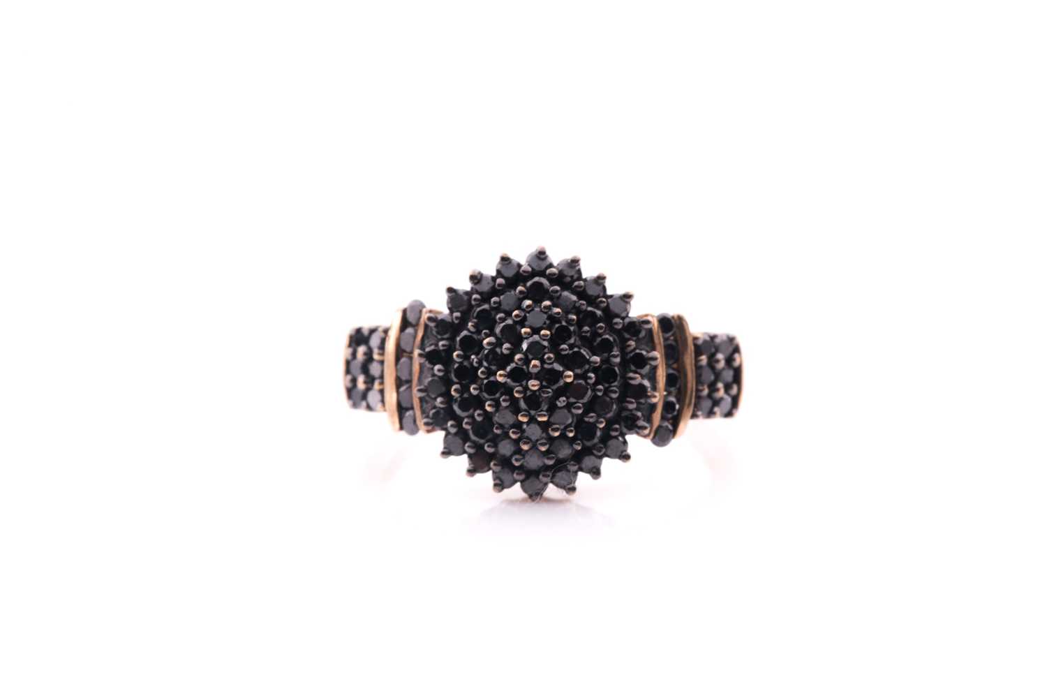 Lot 42 - A black diamond cluster ring; the bombé style...
