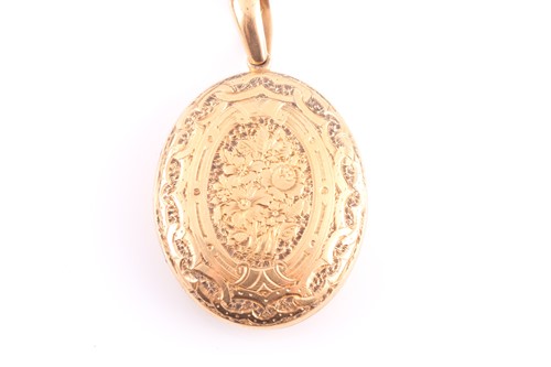 Lot 179 - A Victorian yellow metal locket, the oval case...