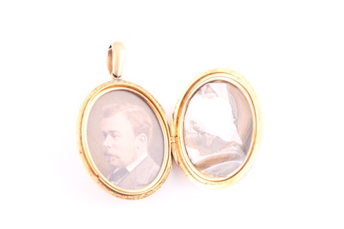 Lot 179 - A Victorian yellow metal locket, the oval case...