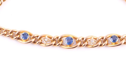 Lot 160 - A 15ct yellow gold, diamond, and sapphire curb-...