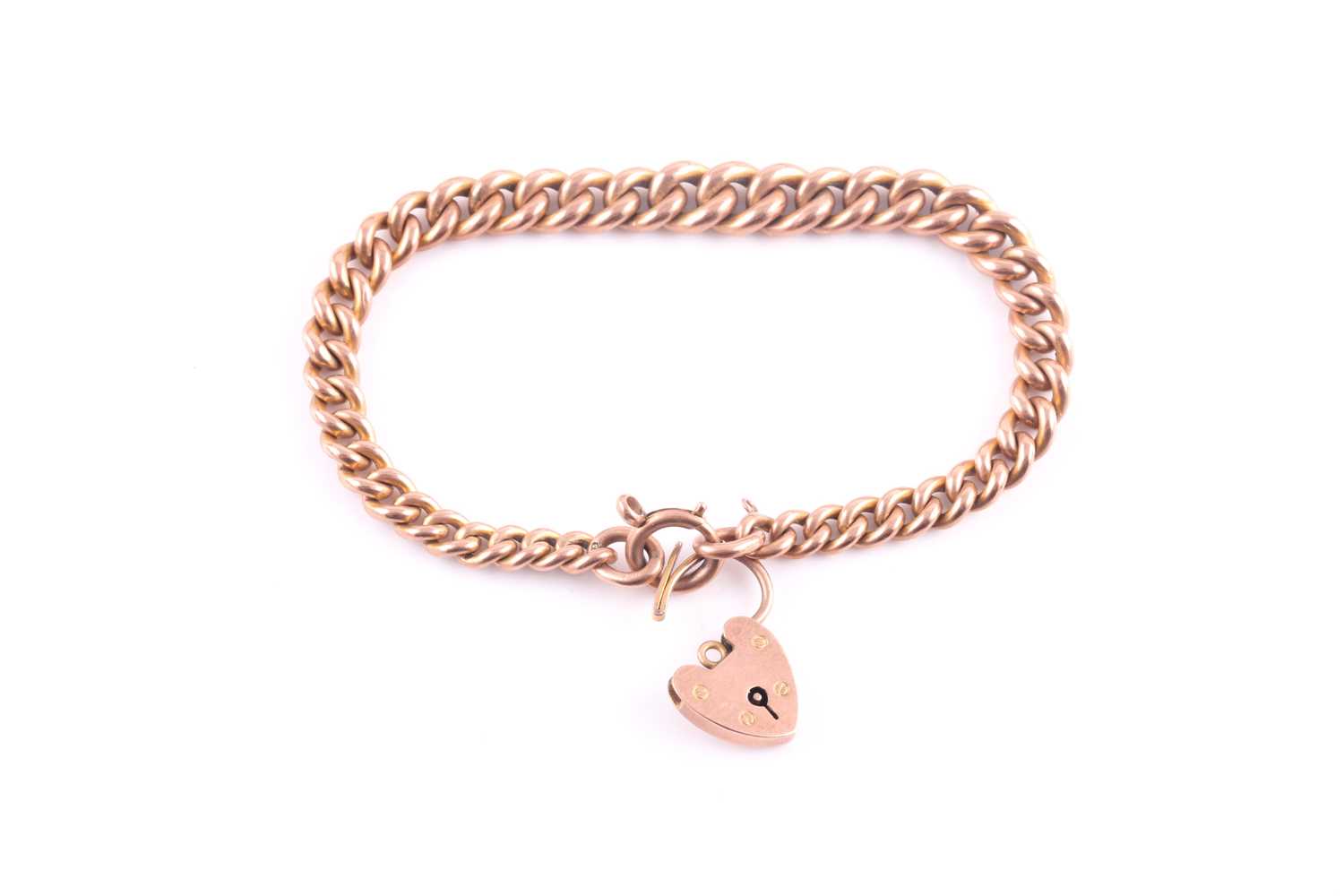 Lot 114 - A 9ct rose gold curb-link bracelet, fastened...