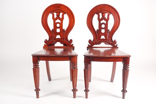 Lot 70 - A pair of Victorian mahogany hall chairs. With...