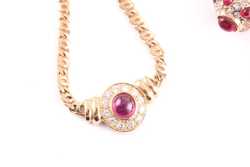 Lot 107 - An 18ct yellow gold, diamond and ruby pendant...