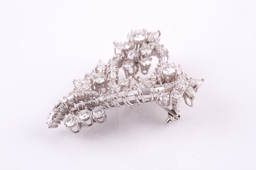 Lot 82 - A white metal and diamond set stylised...