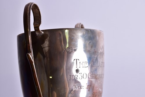 Lot 419 - A 1920s silver two-handled trophy cup and...