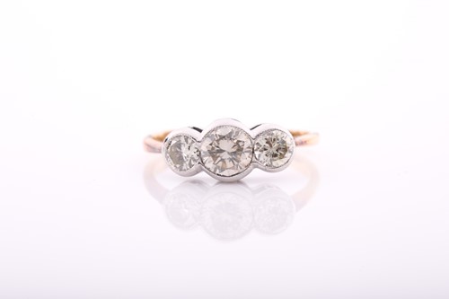 Lot 215 - An 18ct yellow gold and diamond ring,...