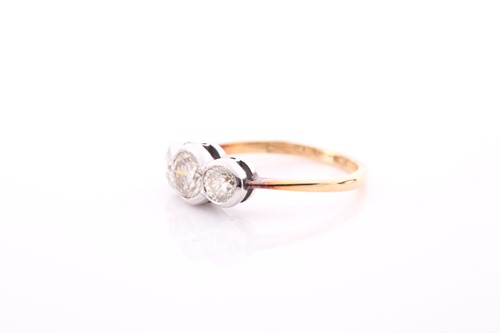 Lot 215 - An 18ct yellow gold and diamond ring,...