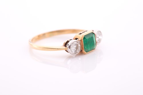Lot 125 - A yellow metal, diamond, and emerald ring, set...