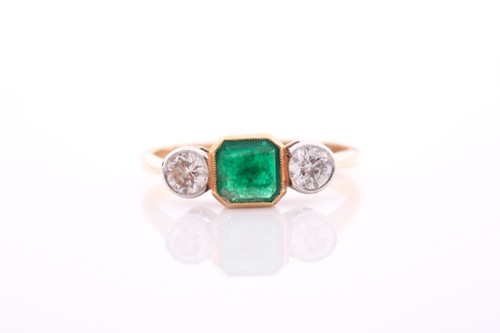 Lot 125 - A yellow metal, diamond, and emerald ring, set...