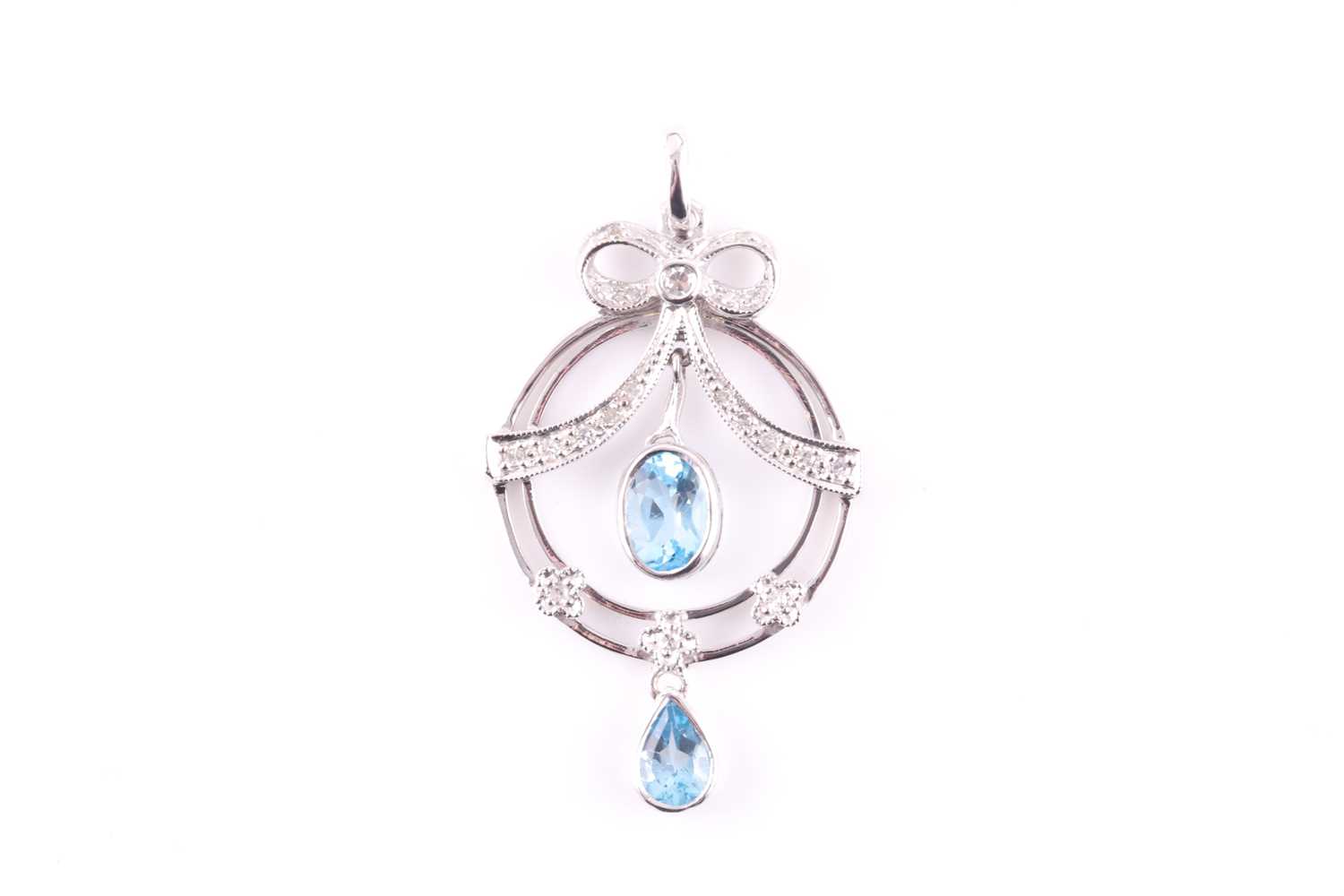 Lot 13 - A diamond and blue topaz drop pendant, in the...