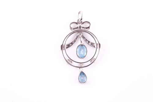 Lot 13 - A diamond and blue topaz drop pendant, in the...