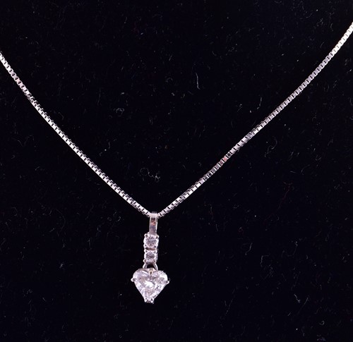 Lot 231 - A white metal and diamond drop pendant, set...