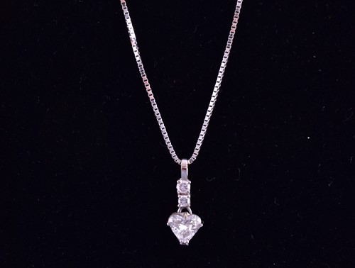 Lot 231 - A white metal and diamond drop pendant, set...