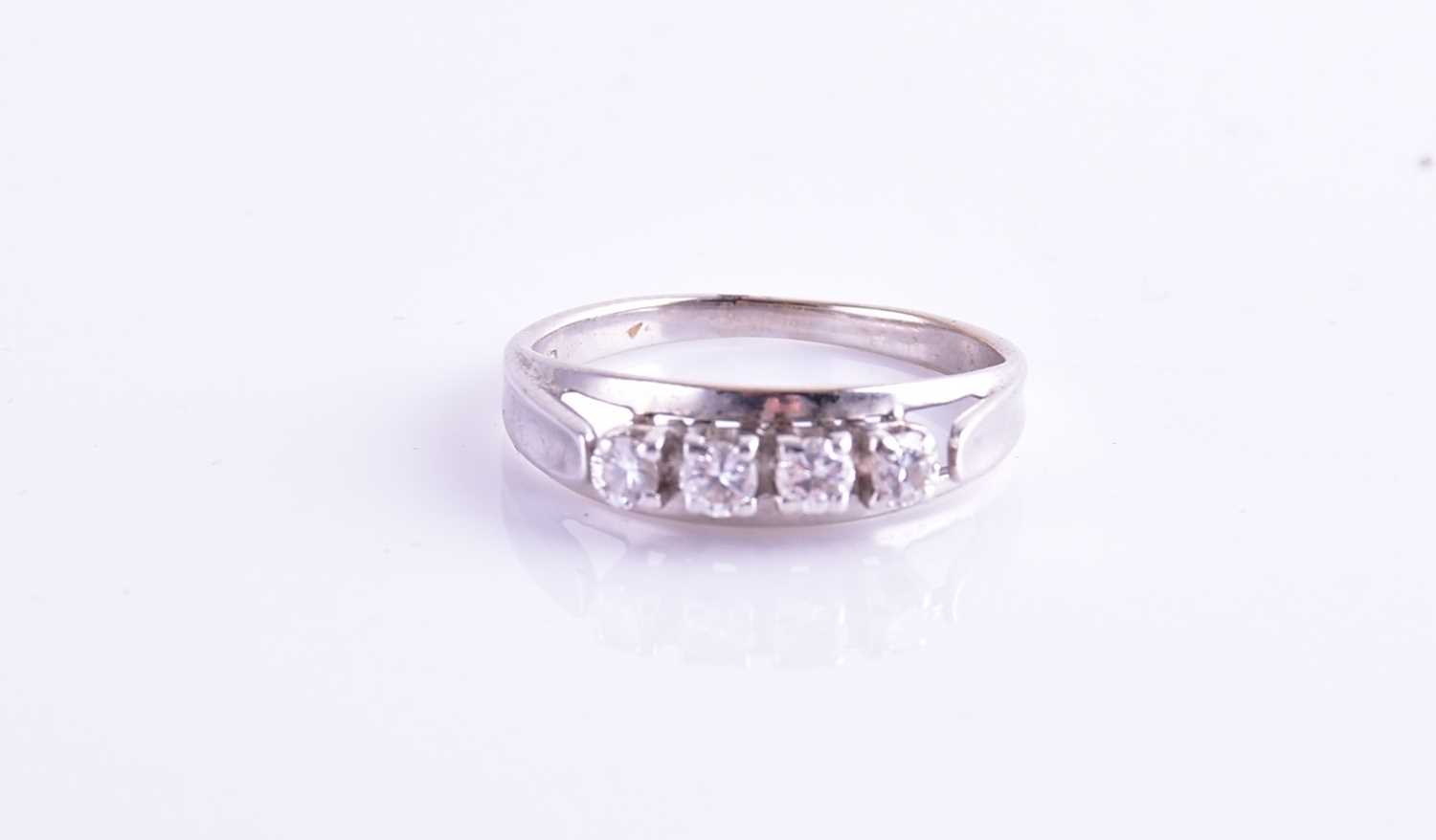 Lot 192 - A white metal and diamond ring, set with four...