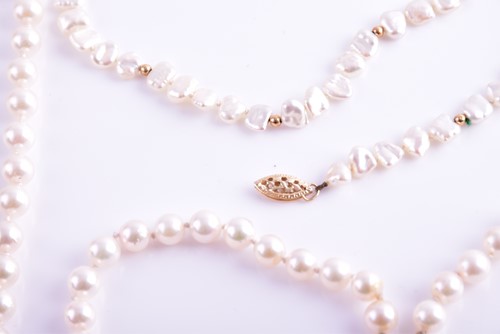 Lot 58 - A cultured pearl necklace with yellow metal...