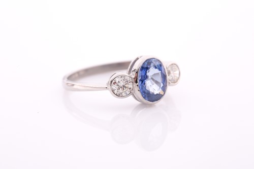 Lot 249 - A platinum, diamond, and sapphire ring, set...