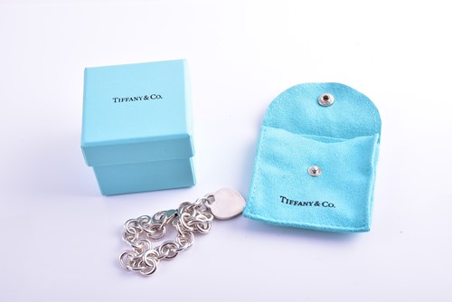 Lot 362 - Tiffany & Co. A silver round-link bracelet,...