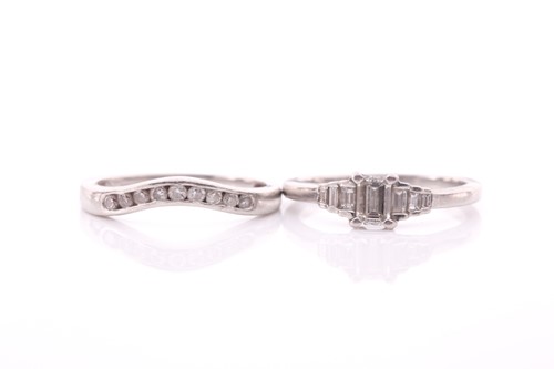 Lot 84 - A platinum and diamond ring, set with an...
