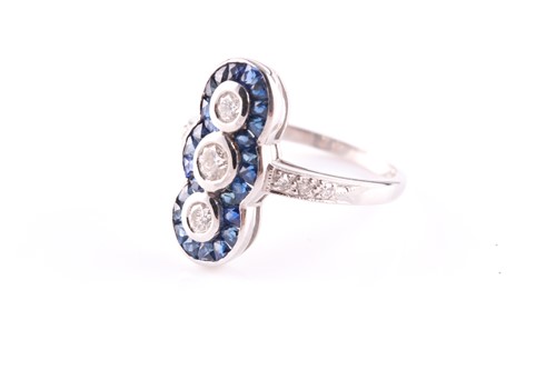 Lot 105 - An 18ct white gold, diamond and sapphire ring,...