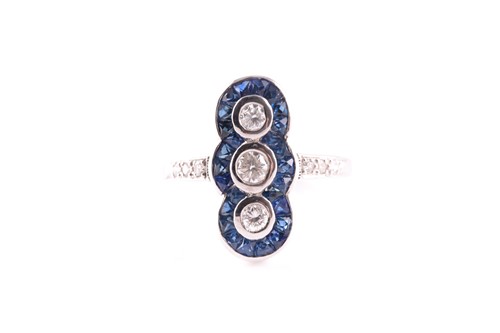 Lot 105 - An 18ct white gold, diamond and sapphire ring,...